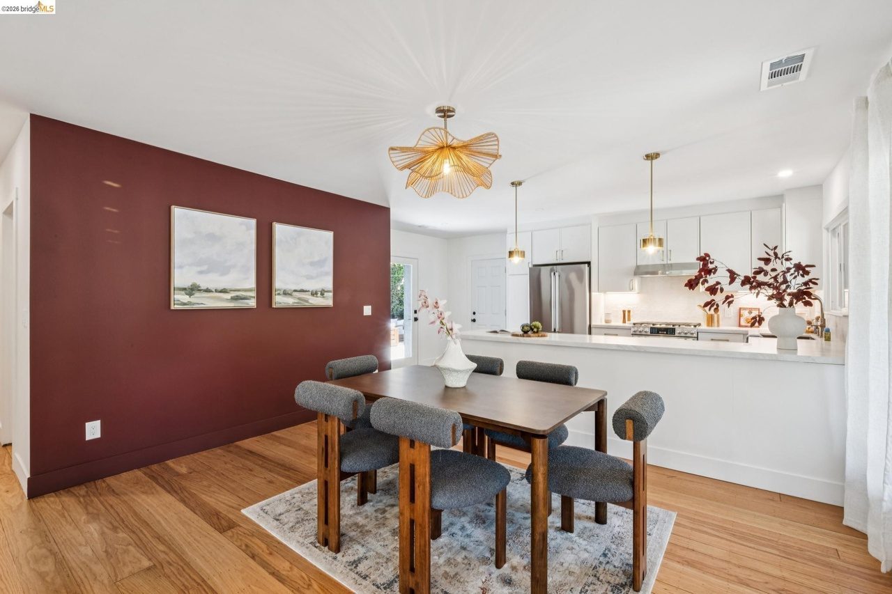 Dining Room with maroon accent wall